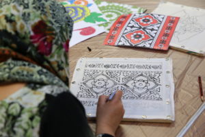 ladt doing fabric painting at West yorkshire history centre
