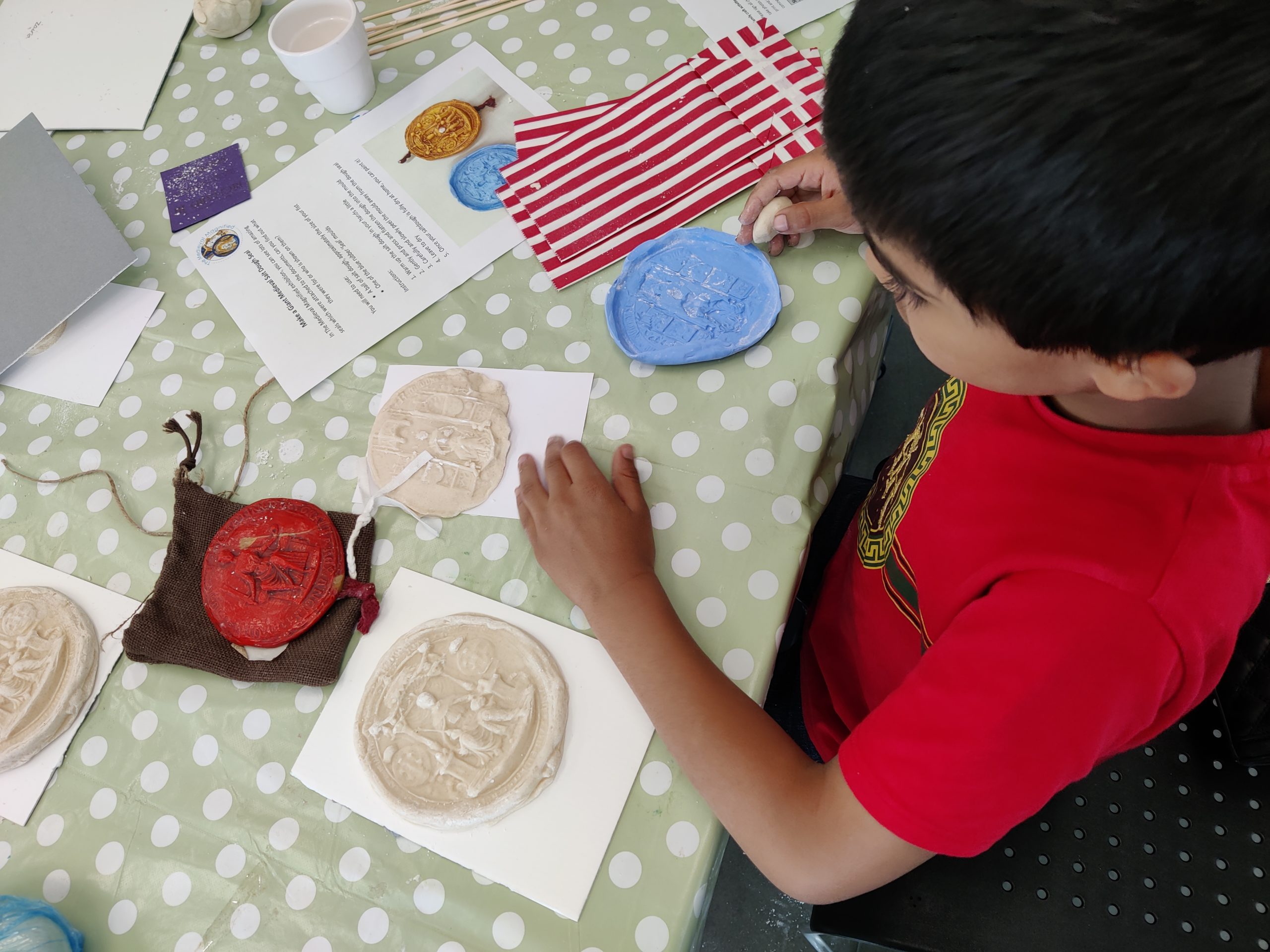 Boy doing craft activites at West Yorkshire History Centre